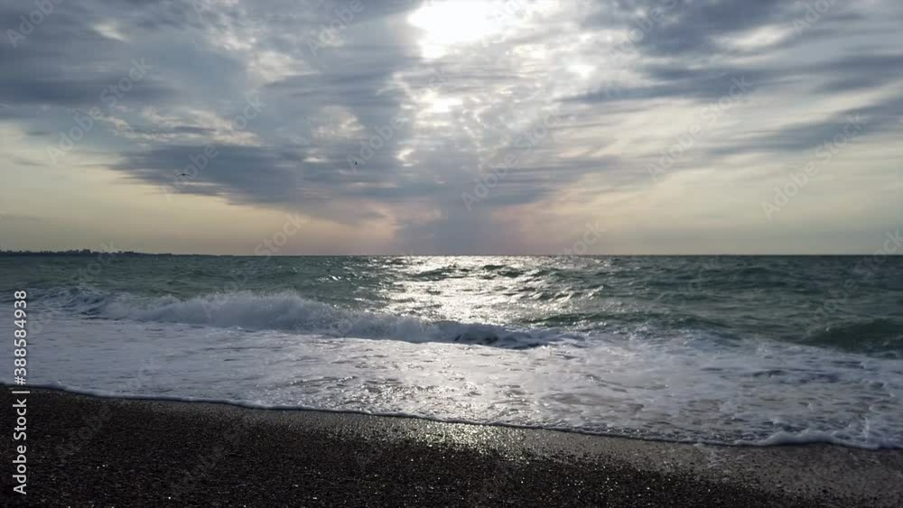 View from the beach to the stormy sea in September. View from the beach to the stormy sea in September.