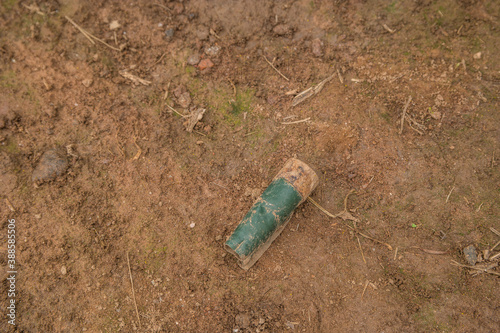 Shotgun shell laying on the ground