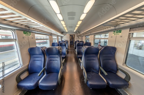 View of the interior of a train with empty seats