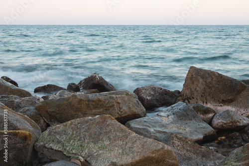 Landscape of the mediterranean sea with rocks in the front  movement of the waves in long exposure