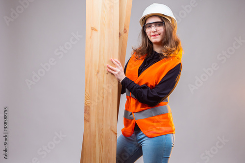 Builder woman on a gray bac...