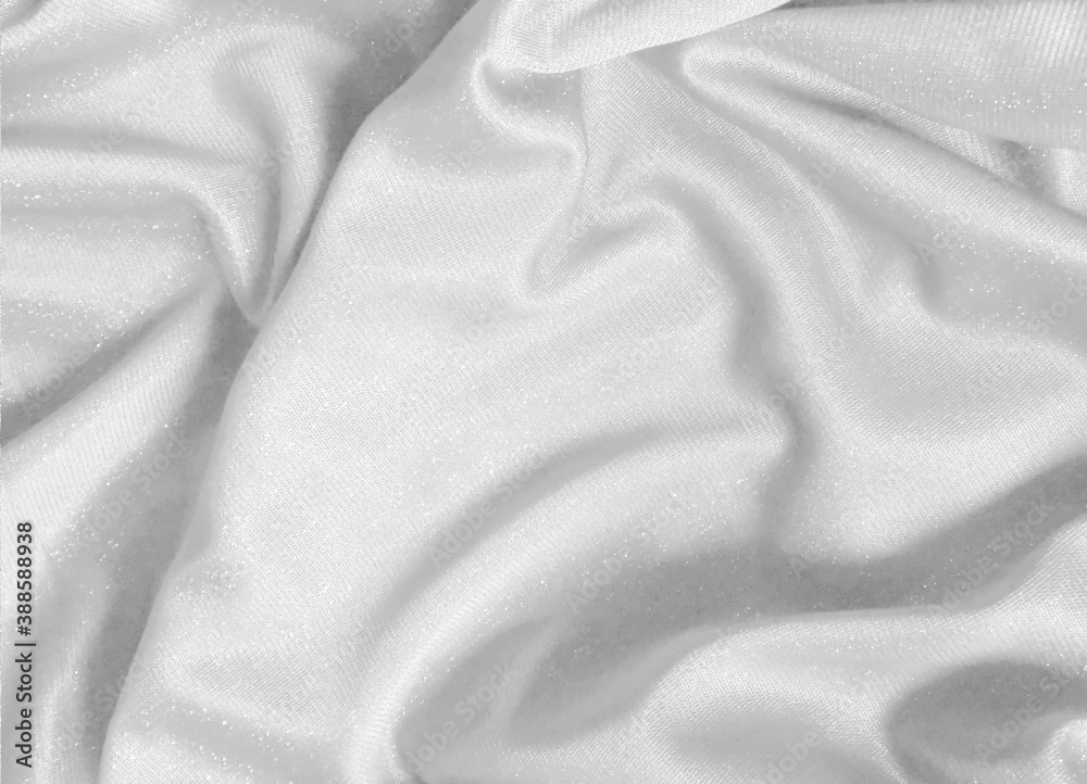 Fototapeta premium Shiny white crumpled fabric. Elegant cloth texture background