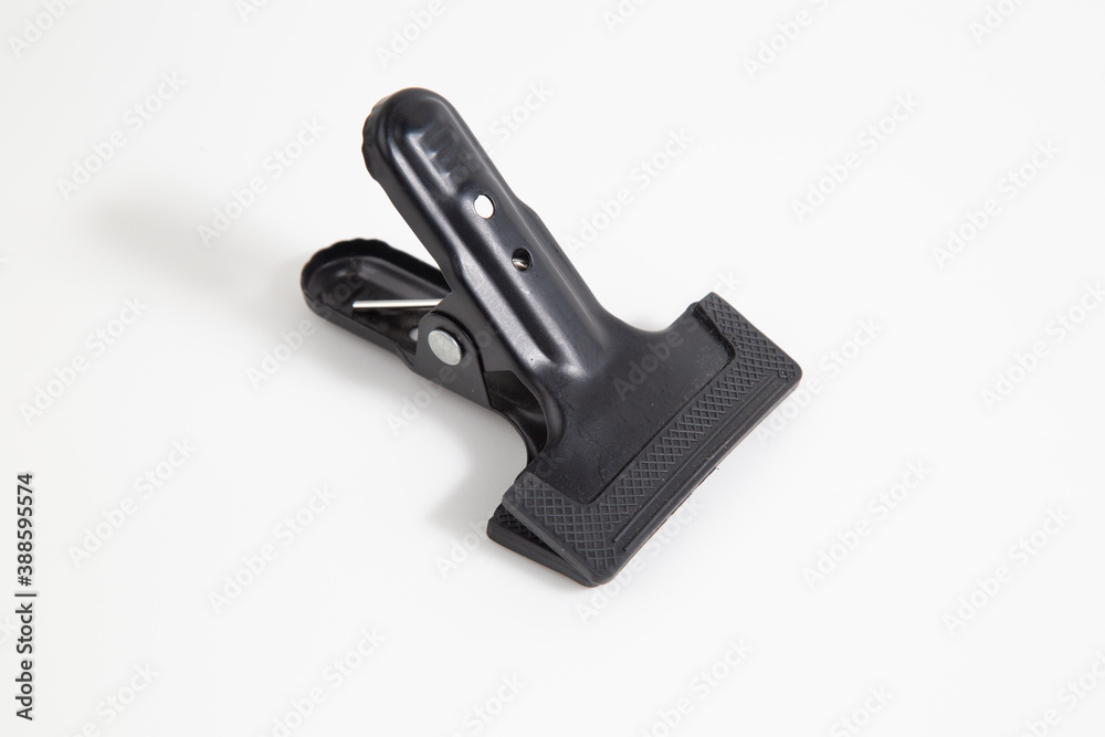 Clothespins are black on a white background.A tool for photos. Clothespins are black on a white background.A tool for photos.