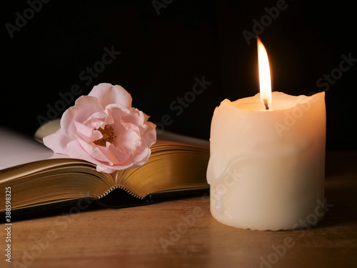 Canvas Print Bible book, candle and rose, symbolic for funeral