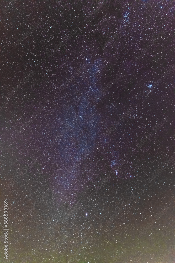 Fototapeta premium A beautiful starry night in the mountains on top with beautiful scenery and fog.