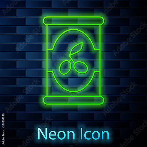 Glowing neon line Olives in can icon isolated on brick wall background. Concept of canned food. Vector.