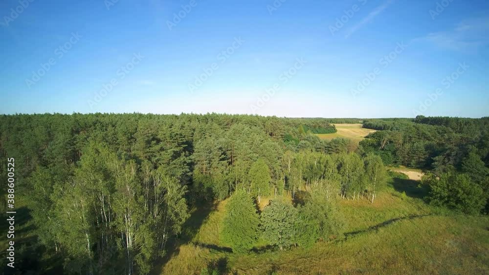 Low flyover over a small wild river on a summer day, river Grabia, Poland. Low flyover over a small wild river on a summer day, river Grabia, Poland.