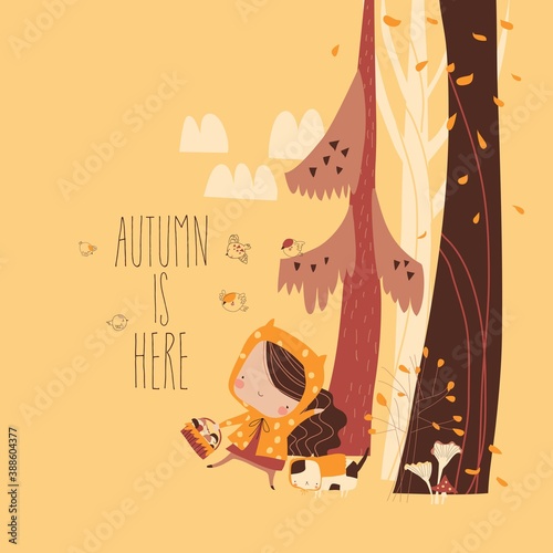 Cute girl picking mushrooms with her cat in the autumn forest