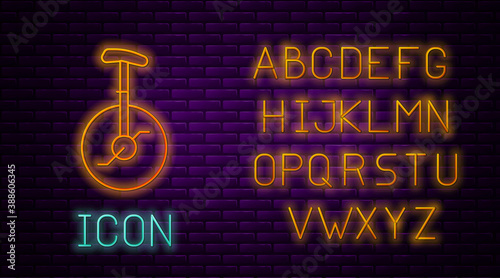Glowing neon line Unicycle or one wheel bicycle icon isolated on brick wall background. Monowheel bicycle. Neon light alphabet. Vector.