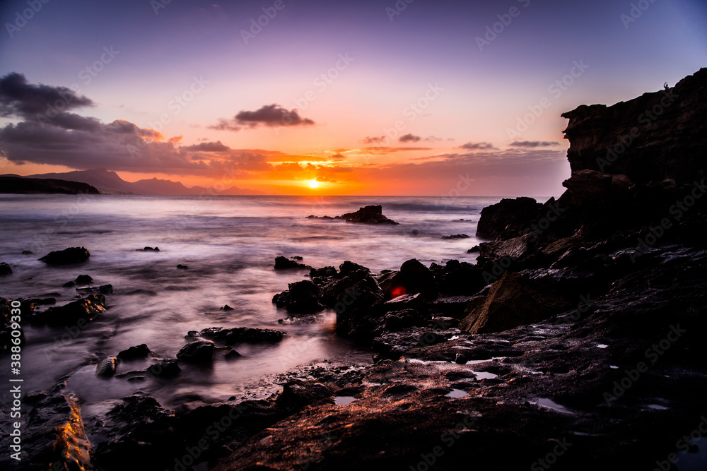 Waves and sunset at the coastline of Fuerteventura