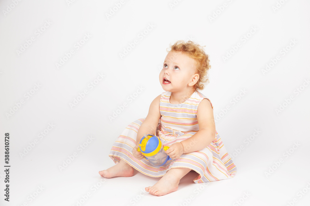 little girl with curly hair on a light background little girl with curly hair on a light background