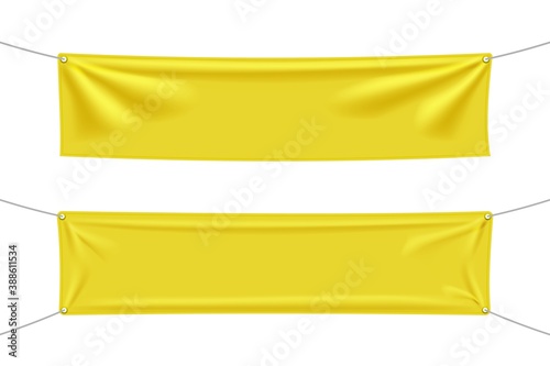 Yellow textile banners with folds isolated on white background