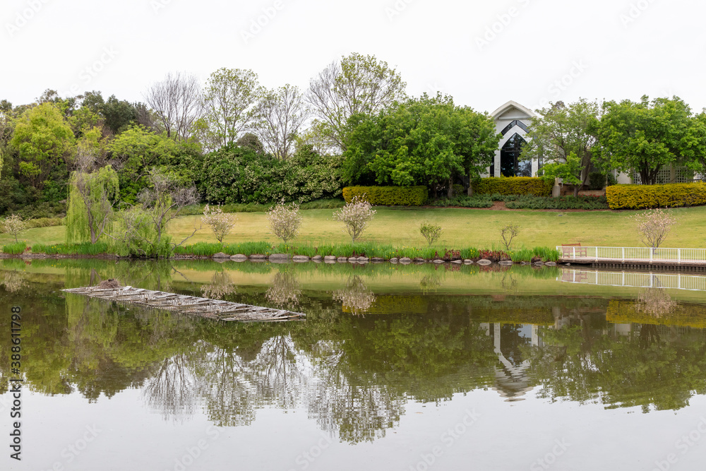 Fototapeta premium A fireworks pontoon floating on a lake in a garden