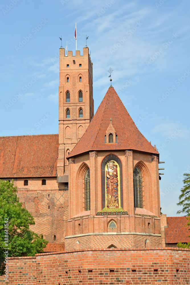 Chapel of St. Anne against the backgdround of the main tower of the Teutonic Knight's Castle. Malbork, Poland