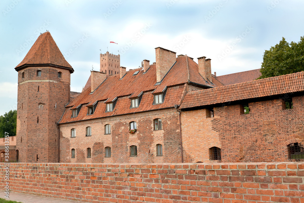 Watchtower and brick buildings on the territory of the chivalrous castle of the Teutonic Order. Marlbork, Poland