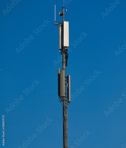 A GSM antenna on a sky blue background