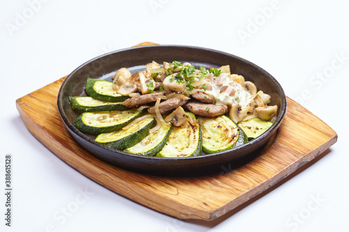 meat with vegetables in pan