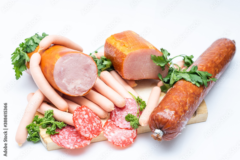 Meat and sausages. Isolated on white. Meat and sausages. Isolated on white.