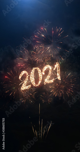 2021 vertical greeting text with particles and sparks on black night sky with colored fireworks on background, beautiful typography magic design, portrait orientation.