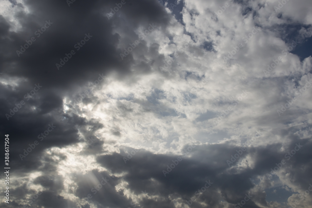 blue sky with white and rainy clouds on a sunny autumn day