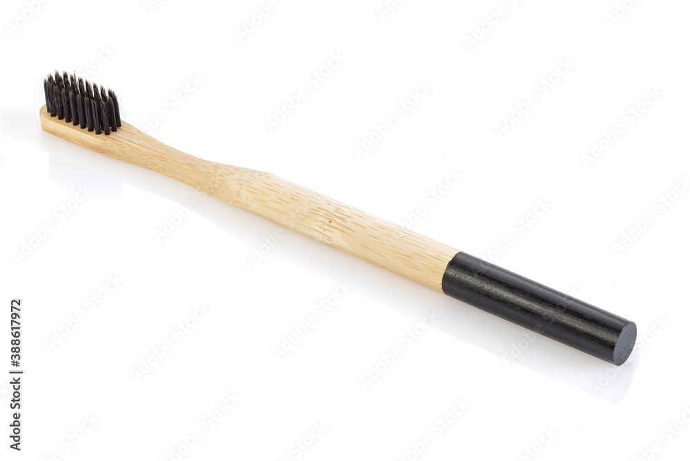 Natural eco friendly bamboo toothbrushes with charcoal bristles isolated on white background. Flat lay, zero waste, no plastic concept. Full depth of field. Natural eco friendly bamboo toothbrushes with charcoal bristles isolated on white background. Flat lay, zero waste, no plastic concept. Full depth of field.