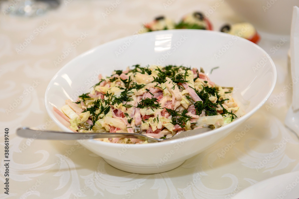 Mixed salad of vegetables and meat. Festive cold appetizer on the table. Mixed salad of vegetables and meat. Festive cold appetizer on the table.