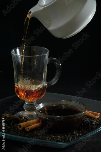 Festive hot tea, golden honey with star anise and cinnamon