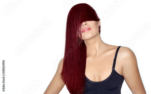 Hair color and hair care concept. Beauty model girl with healthy long mahogany hair