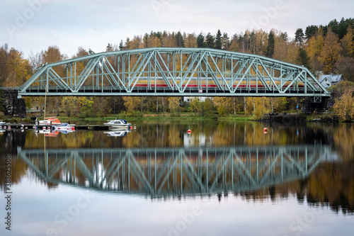 Train crossing bridge at the morning, slow shutter speed