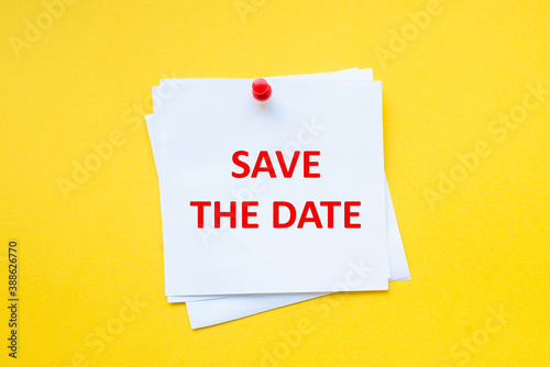 Text save the date on white sticker with yellow background