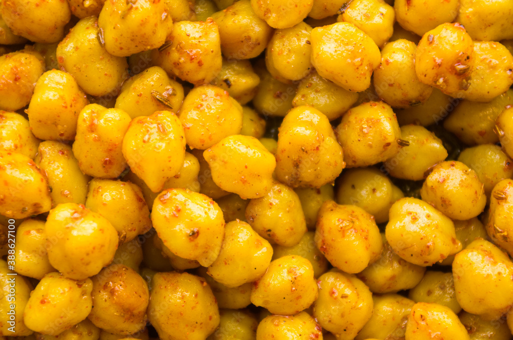Cooking chickpeas with spices in a pan, close-up Cooking chickpeas with spices in a pan, close-up