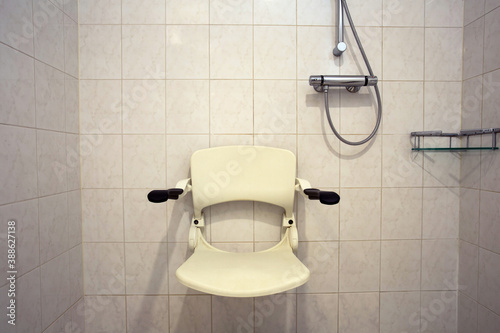 Shower seat wall mounted for disabled person or elderly, shower for handicapped or senior home photo