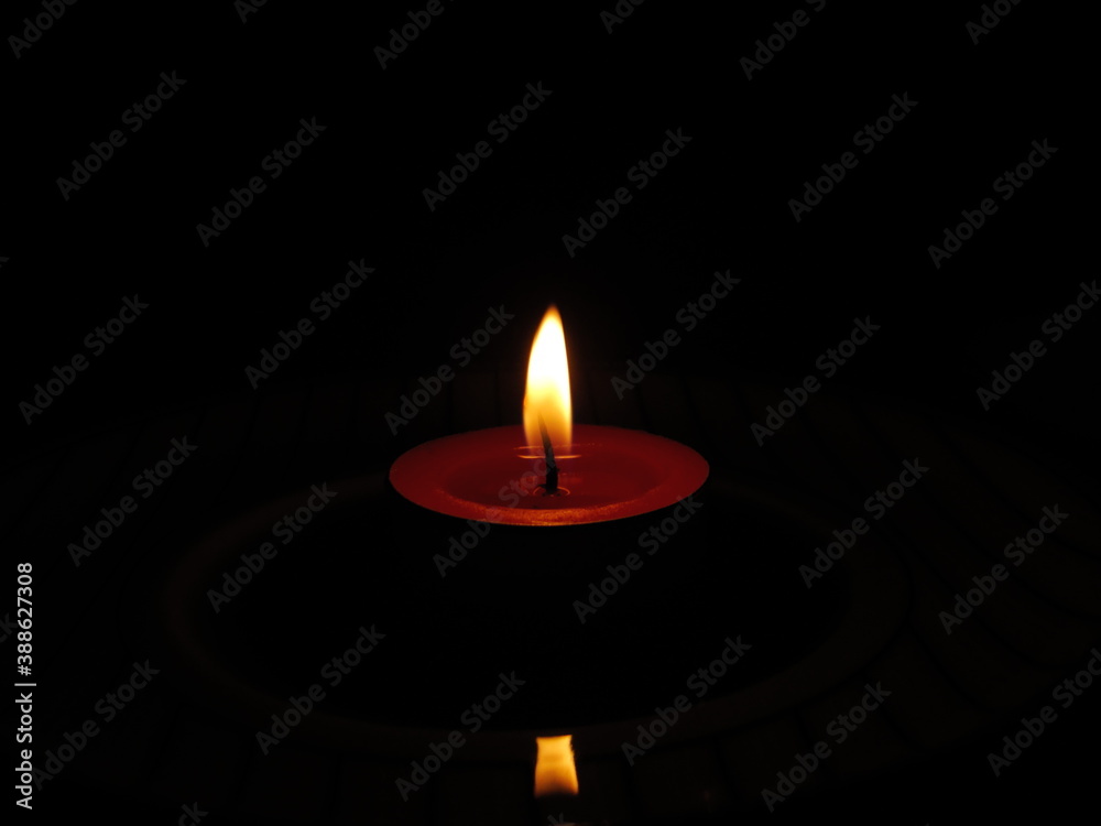 burning candle in the dark