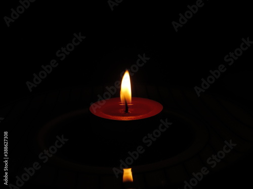 burning candle in the dark