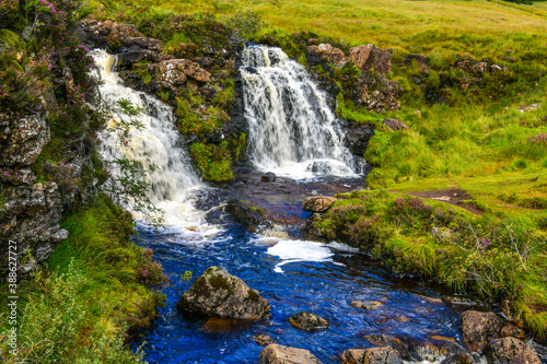 beautiful landscapes  waterfalls  forests full of mushrooms and views of the Isle of Skye in Scotland