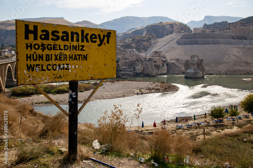 Hasankeyf sign on the road in mountains before the bridge get under the water photo