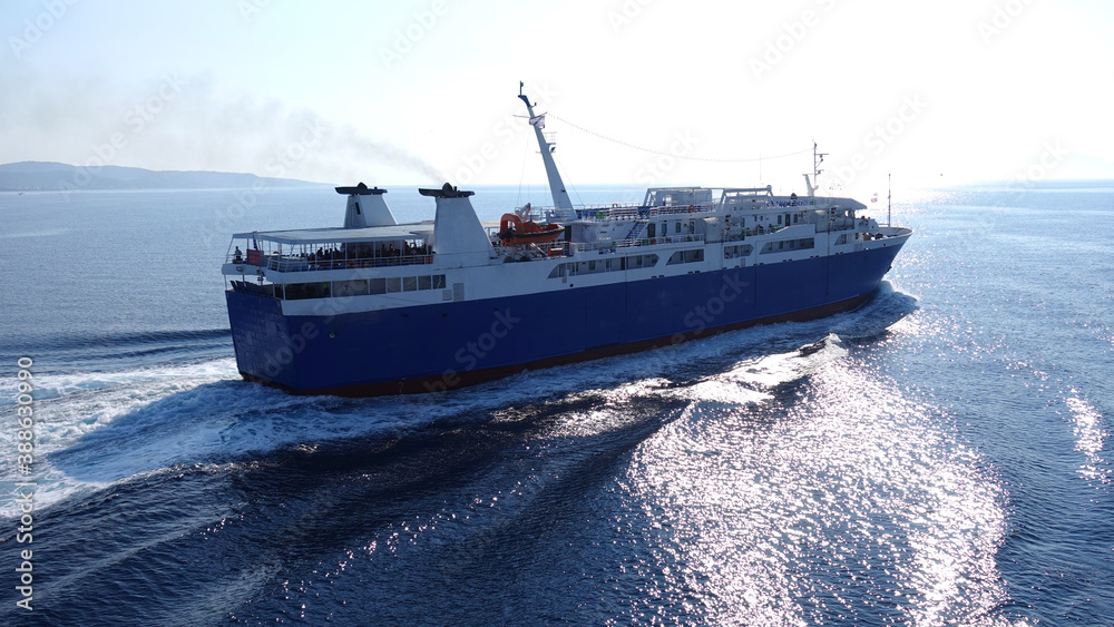 Passenger ferry reaching destination - busy port of Piraeus, Attica, Greece