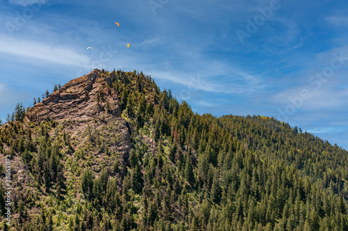 paragliders over mountain