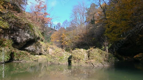 Wallpaper Mural Calm Alpine river flowing downstream between huge boulders in autumn season. Amazing nature in Slovenia. Tilt down, 4K, real time Torontodigital.ca