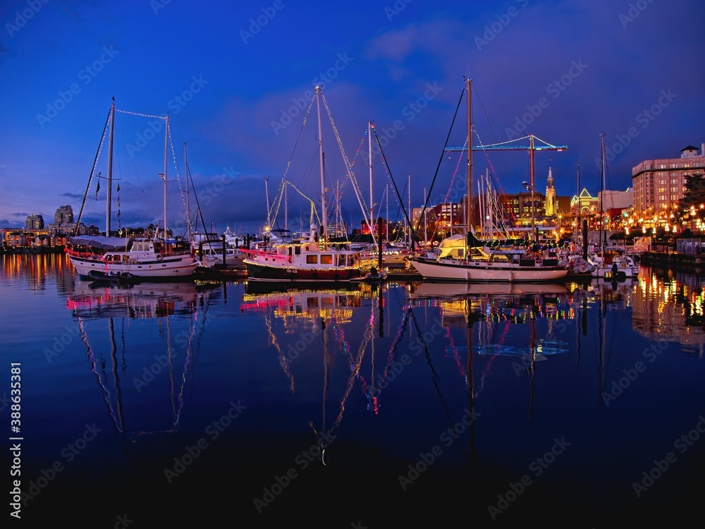 Fototapeta premium Inner Harbor in Victoria BC, Vancouver Island, Canada,decorated with festive lights during Christmas time