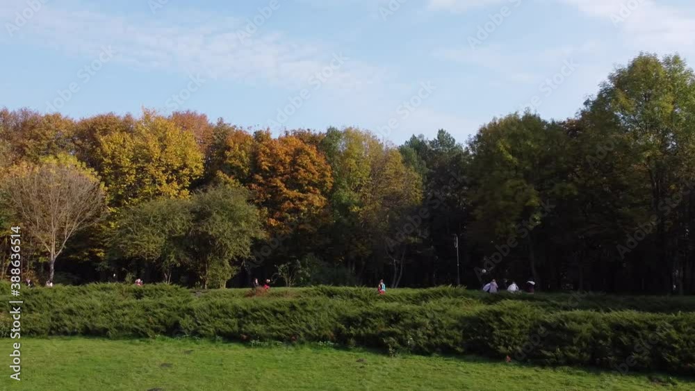 Aerial view of a drone flying over the park.
Aerial view of a drone flying over the park.