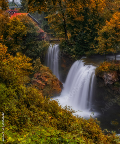 Waterfall Veliki Buk - Big Buk in green nature of Korana river  village of Rastoke  Slunj  Croatia. Autumn 2020. Long exposure picture.