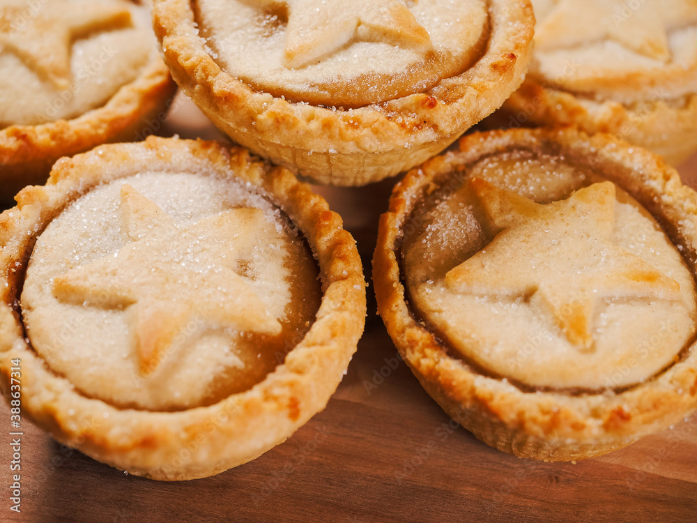 Delicious mince pie pastry on a wooden table. Popular Christmas season dessert