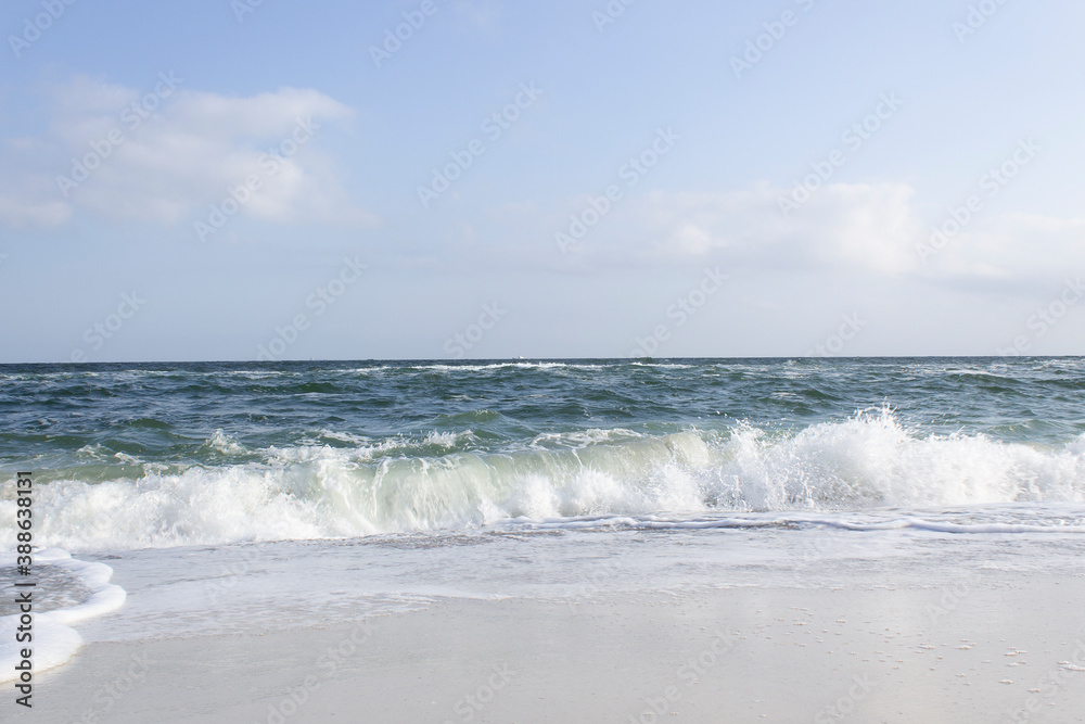 blue sea water waves on sandy beach with panoramic horizon summer holiday travel relax recreation concept 