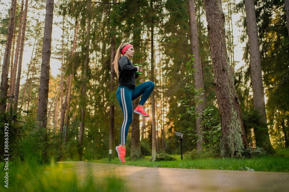 Confident woman training in the park Confident woman training in the park
