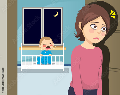 Sleepless young tired mom at night with baby crying on crib