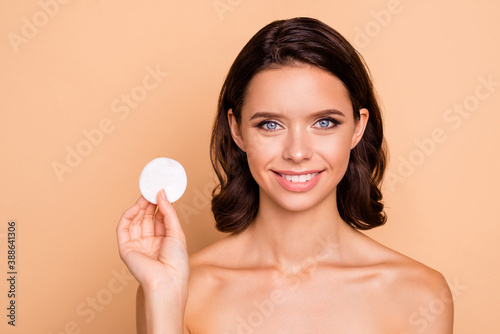 Close up photo beautiful she her lady hand arm hold show pure clean not dirty result advising take make-up down use new cotton pad buy buyer nude wear no clothes isolated pastel beige background