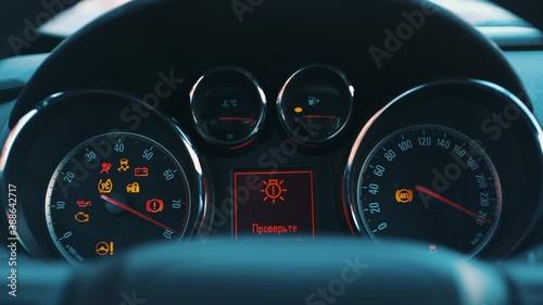 The car dashboard lights up when engine starts photo