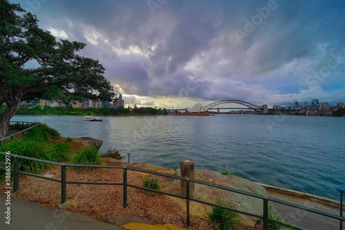 Beautiful colours of Sydney Harbour viewed from Botanical Gardens in NSW Australia on cloudy spring afternoon