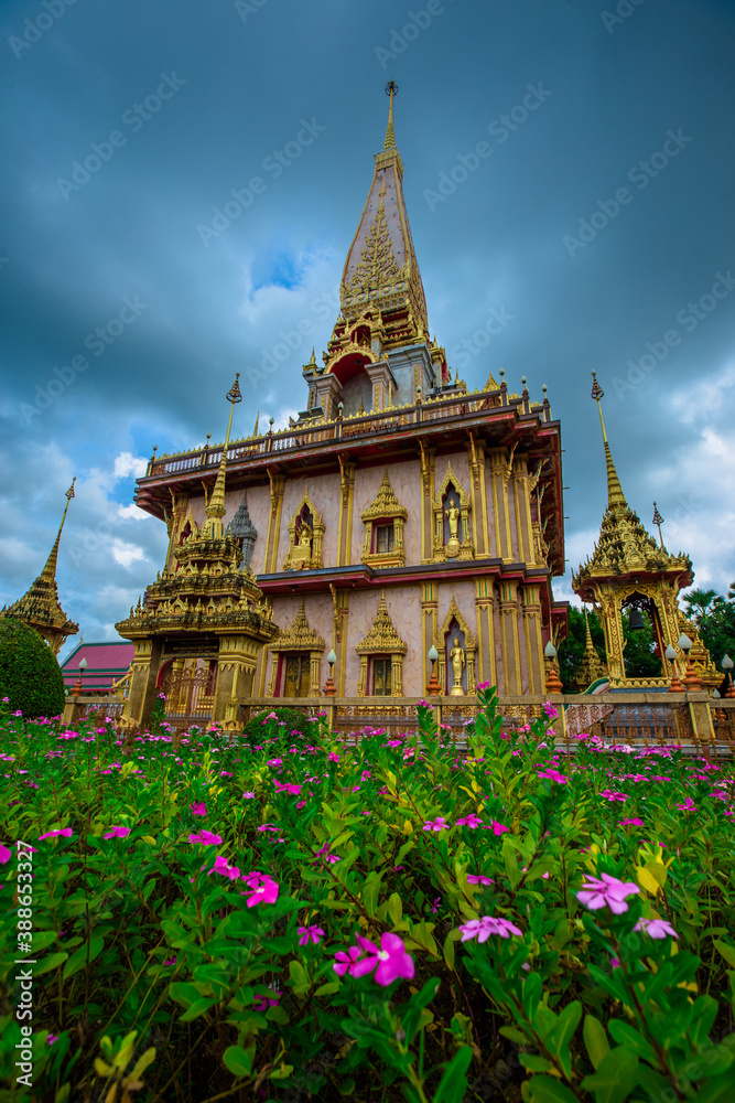 Naklejka premium The background of religious attractions in Phuket (Chalong Temple) has beautiful churches, always frequented by foreign tourists and Thai people to make merit.